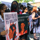 People hold up signs as they gather for a rally to celebrate the 10th anniversary of the Deferred Action for Childhood Arrivals (DACA) in Battery Park on June 15, 2022 in New York City